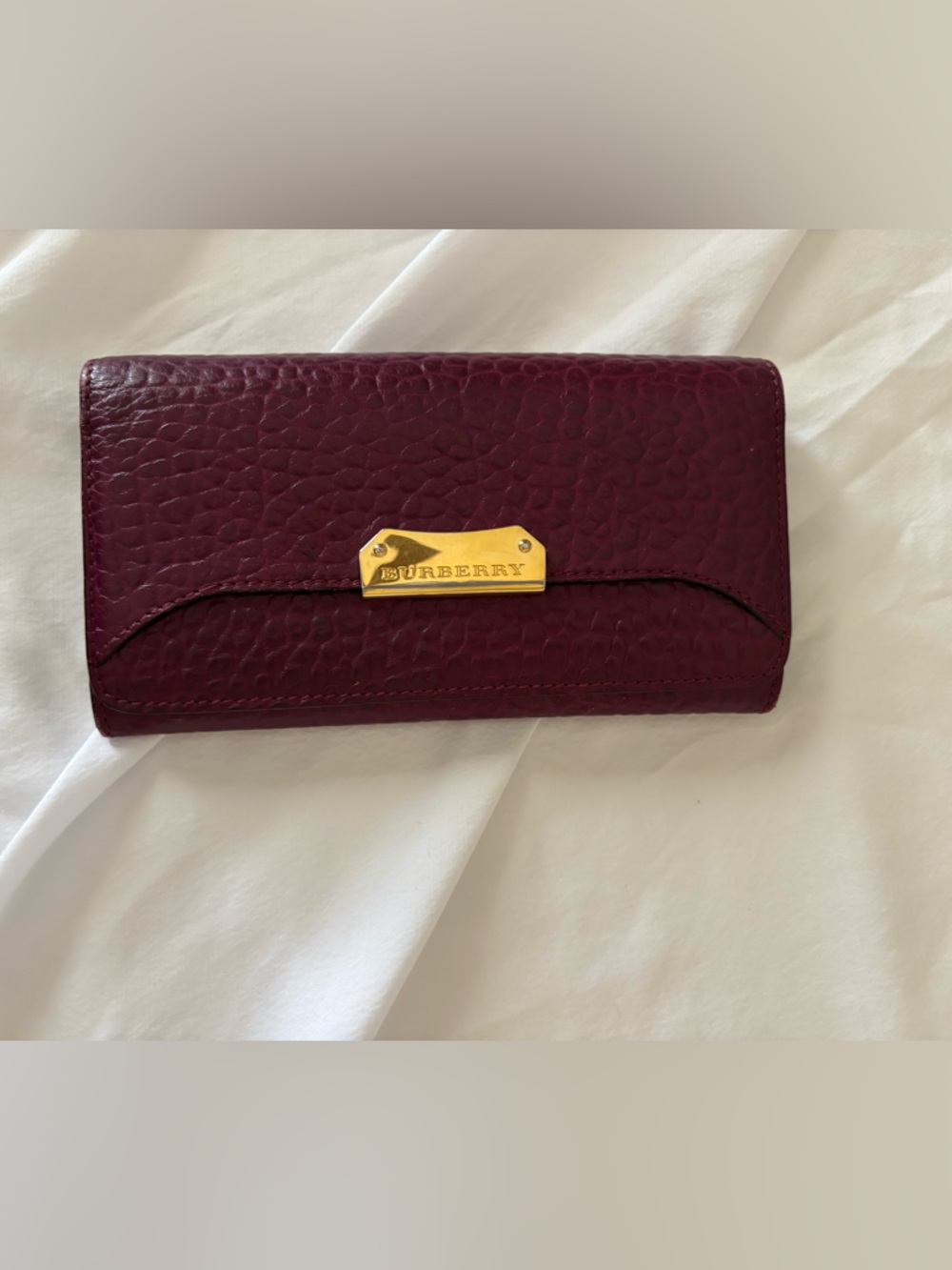 Authentic Burberry Damson Magenta, textured Leather Wallet w/ Gold Plaque.